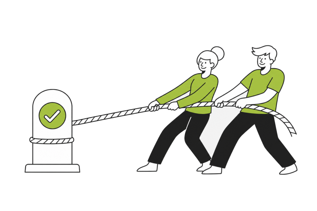 Two people pulling the same rope from the same side, tied to a post marked with a check